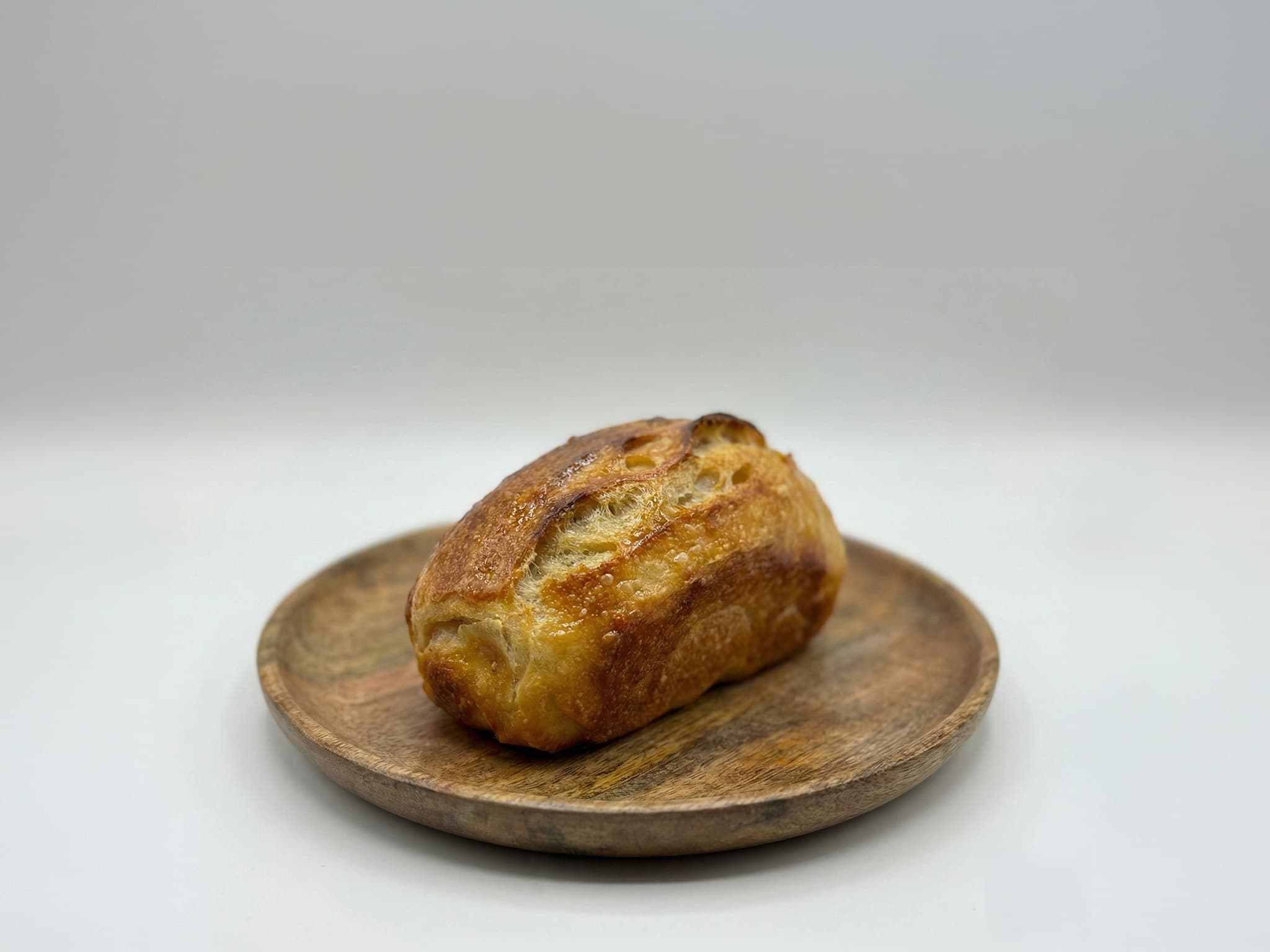Butter sourdough on a wooden plate